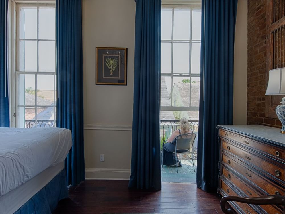 Lady relaxing, Classic King Bed Room balcony, Hotel St. Pierre