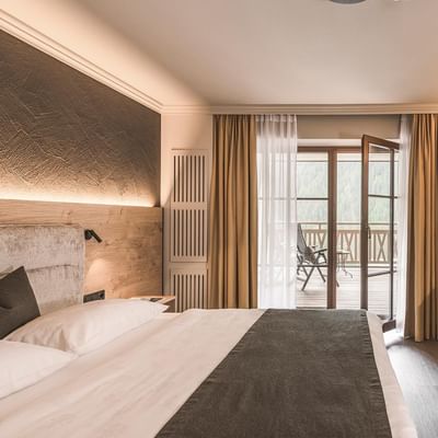 Bed, Double Room Comfort with balcony at Falkensteiner Hotels