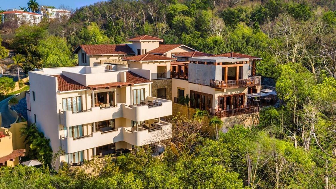 Exterior view of the hotel with trees at Celeste Beach CC Hotel