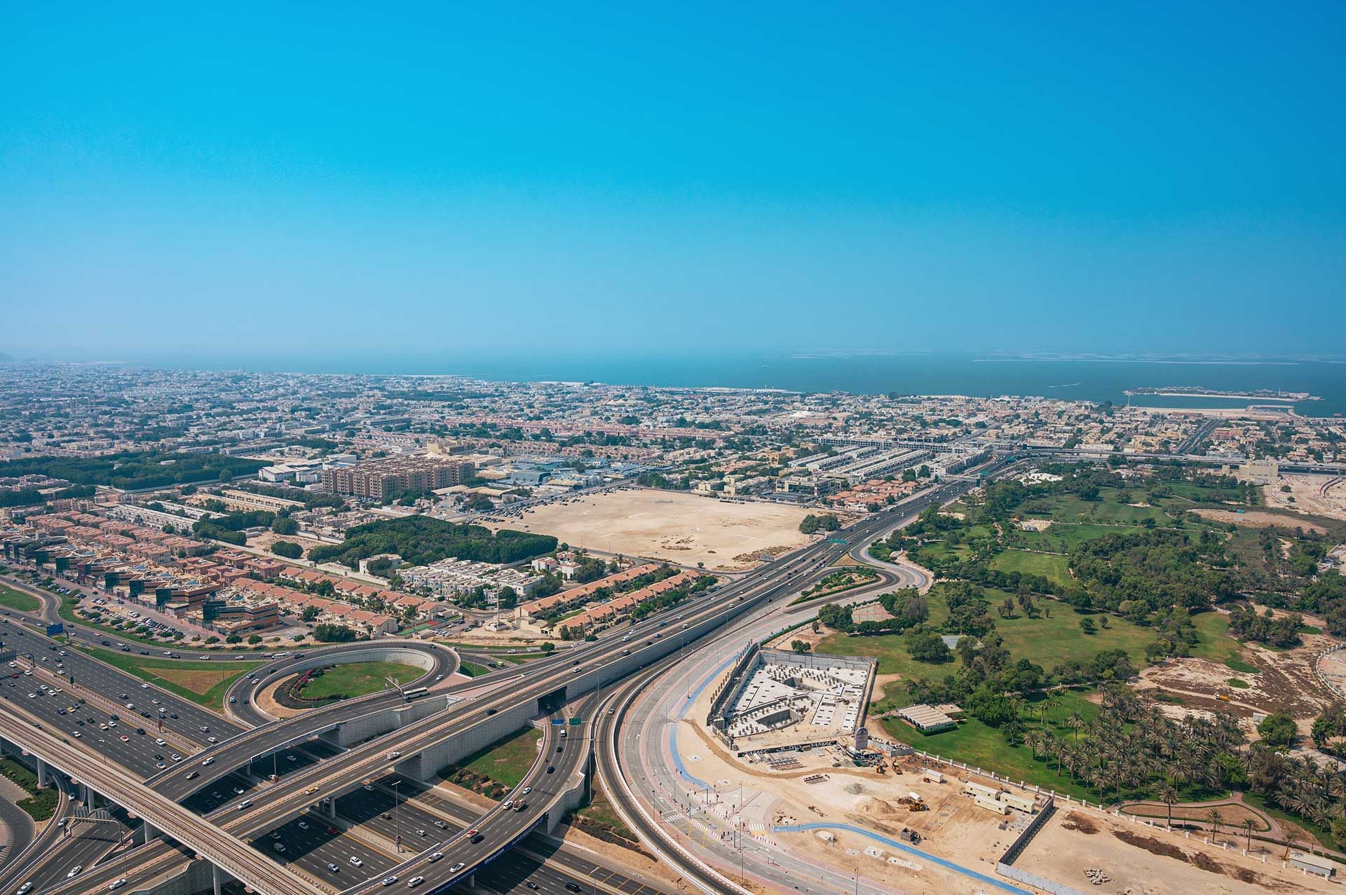 Distance aerial view of DAMAC Maison Aykon City & street view