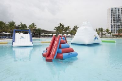 Inflatable bouncers in the pool at Playa Blanca Beach Resort
