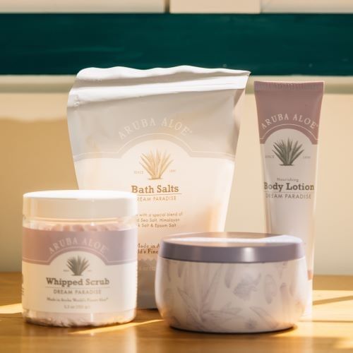 Aruba Aloe wax candle, body lotion, and whipped scrub