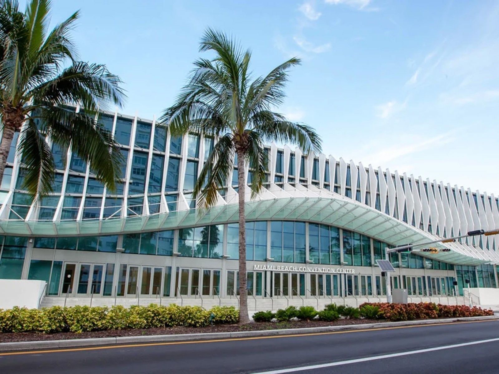 Modern glass architecture of Miami Beach Convention Center near Riviera Hotel South Beach