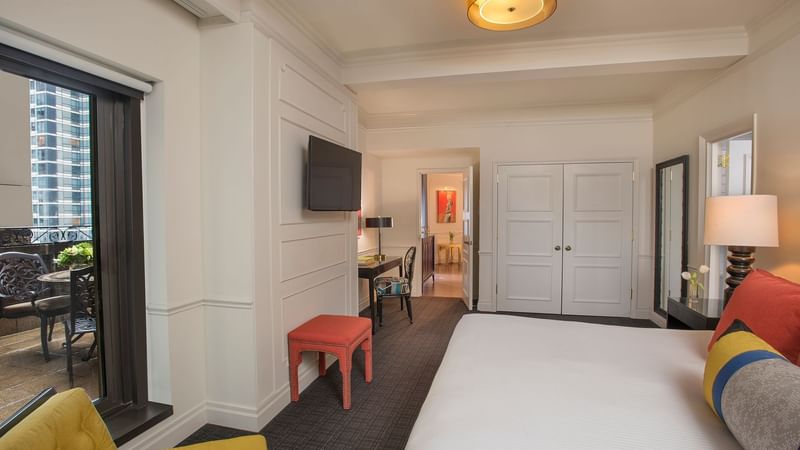 Comfy bed, TV and balcony view in Modern Art Suite at Warwick New York