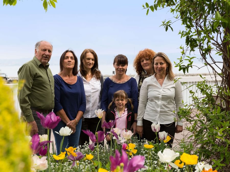 An image of familysmiling in the garden at Hotel Alize