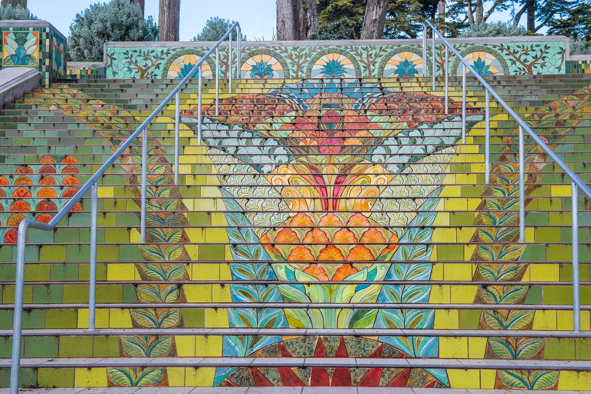 Lincoln Park Steps with floral patterns under metal railings near Warwick San Francisco