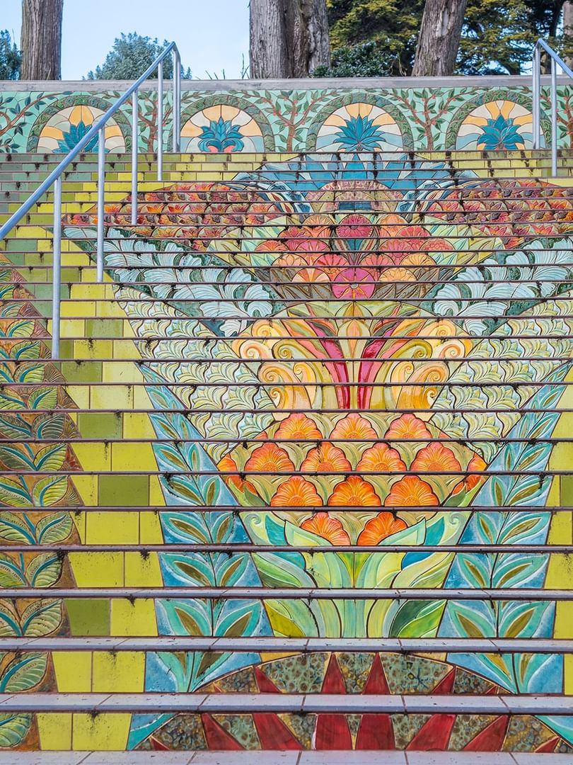 Lincoln Park Steps with floral patterns under metal railings near Warwick San Francisco