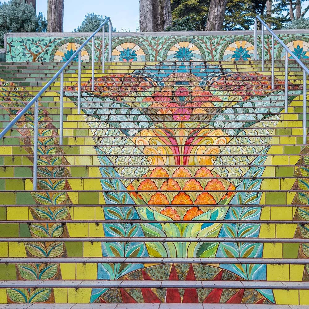 Lincoln Park Steps with floral patterns under metal railings near Warwick San Francisco