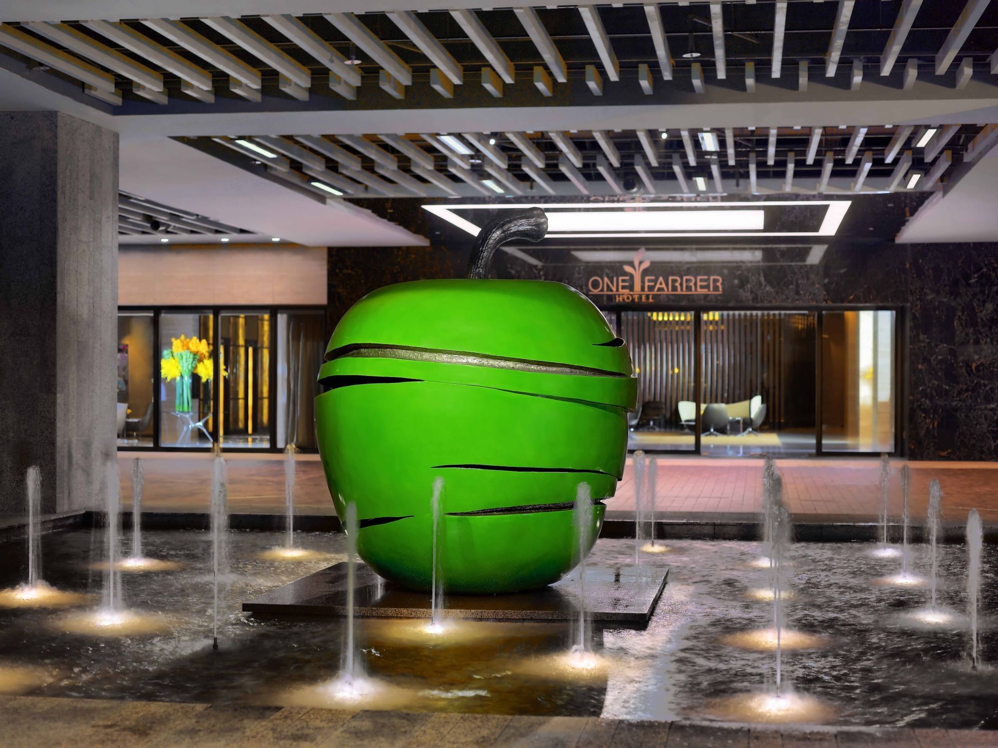 Green apple fountain décor in the Entrance at One Farrer Hotel
