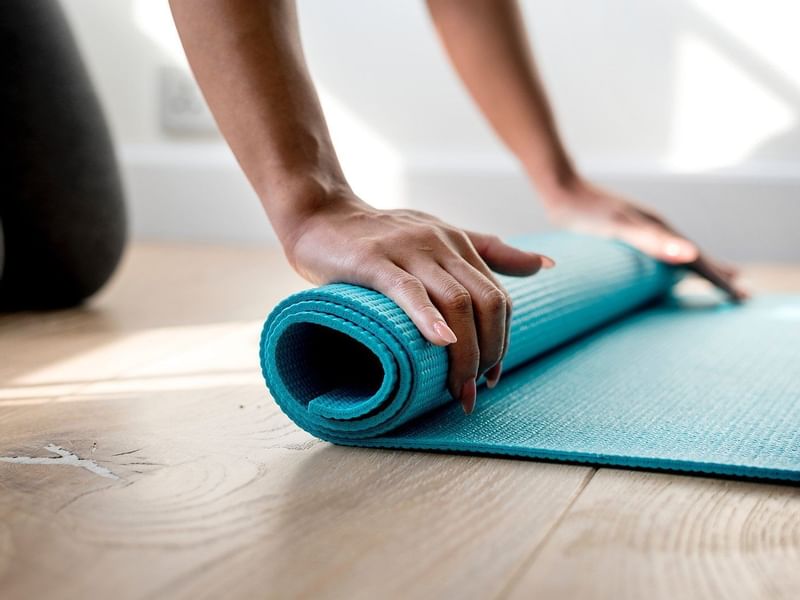 Close up on folding a Yoga mat at Pullman Bunker Bay Resort