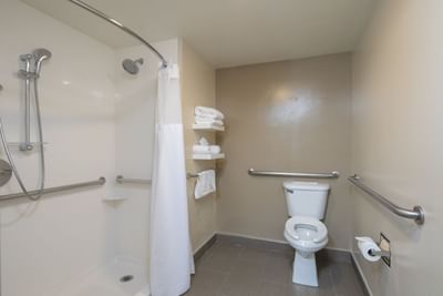 a toilet and shower in a hotel room