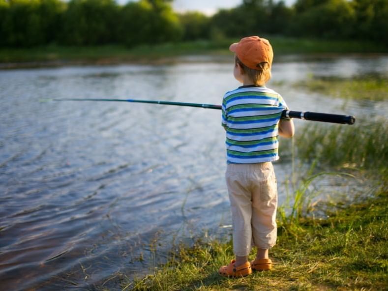 kid in hat fishing