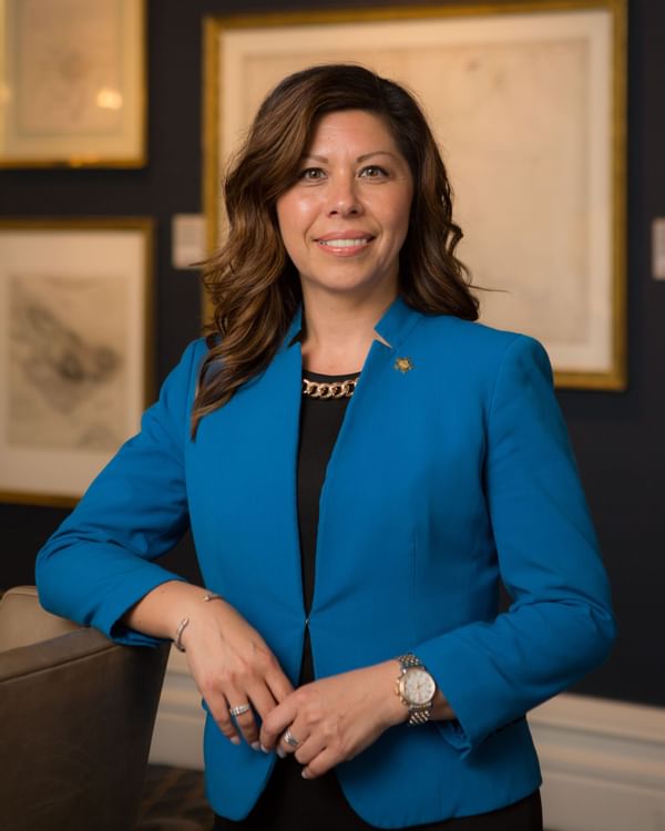 Business women in blue suit wearing a wrist watch
