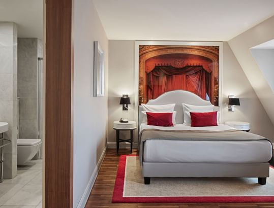 Nightstands by the bed in Junior Suite with wooden floors at Titanic Gendarmenmarkt Berlin