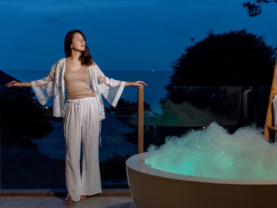 Woman in terrace with jacuzzi with sea view at U Hotels
