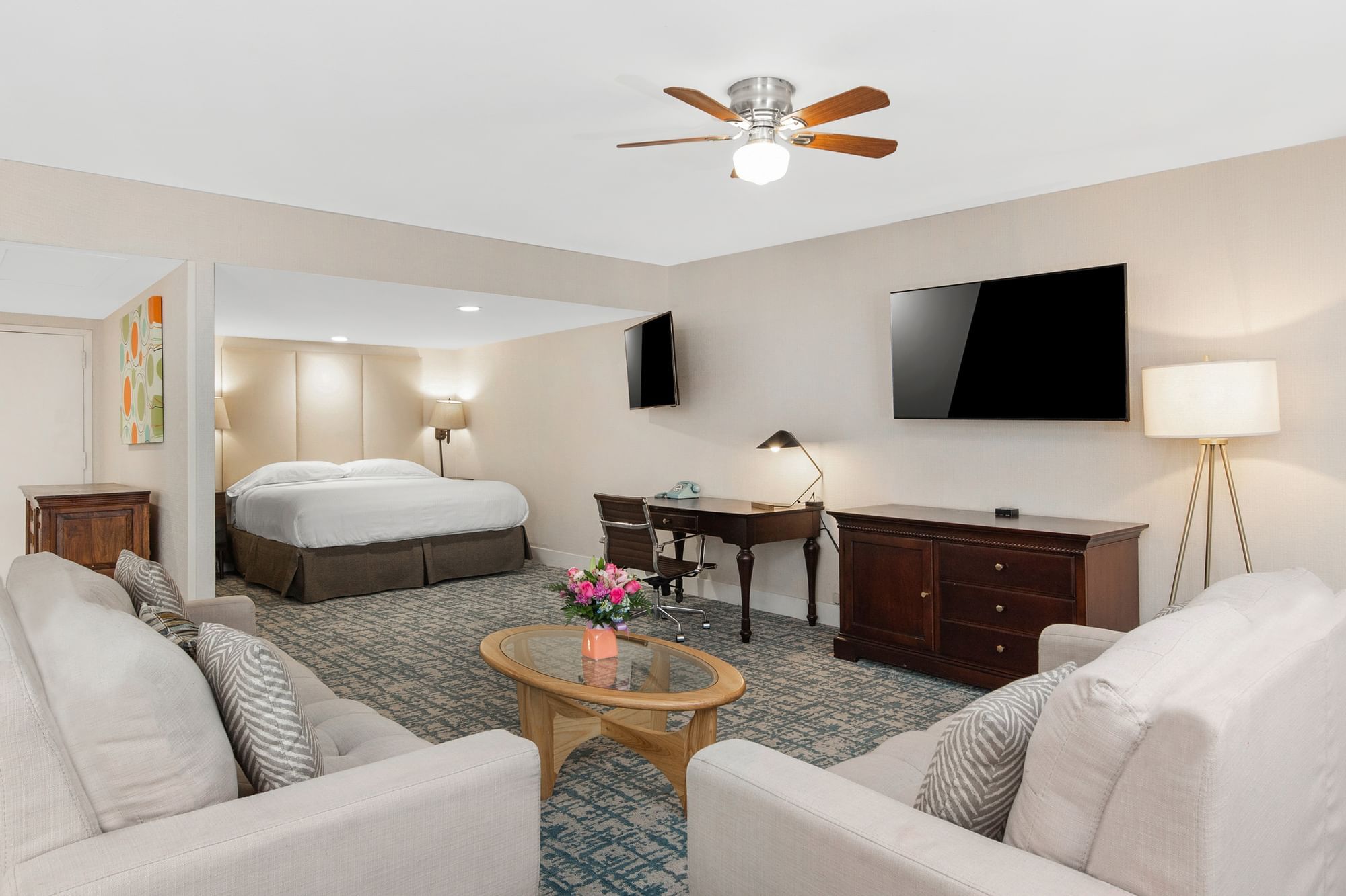 A hotel suite with a living area and bedroom