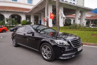Luxurious Mercedes Benz parked in front of a Hanoi Daewoo Hotel