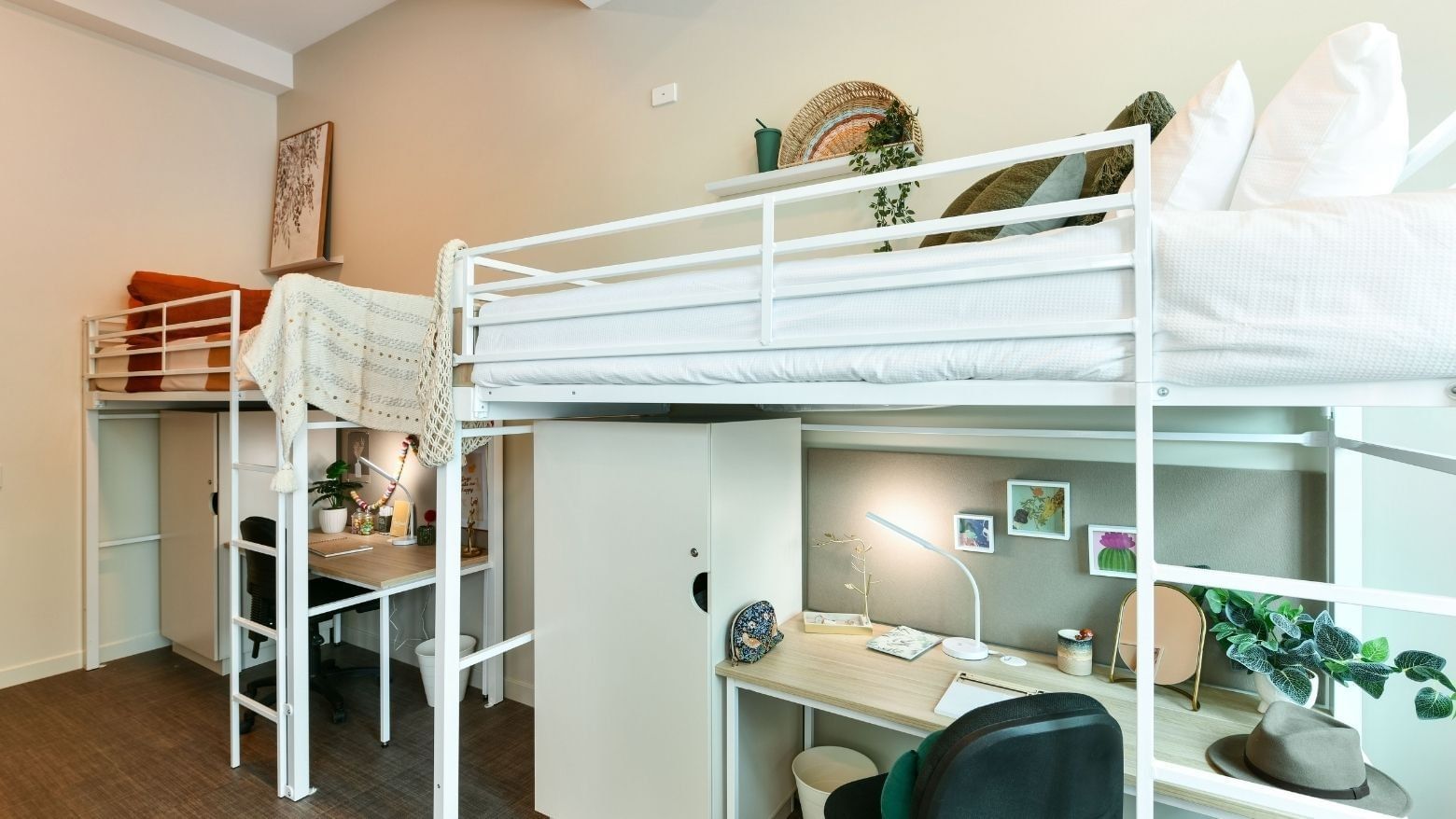 Triple Loft Room with three loft bunk beds with desks underneath at UniLodge Herston.