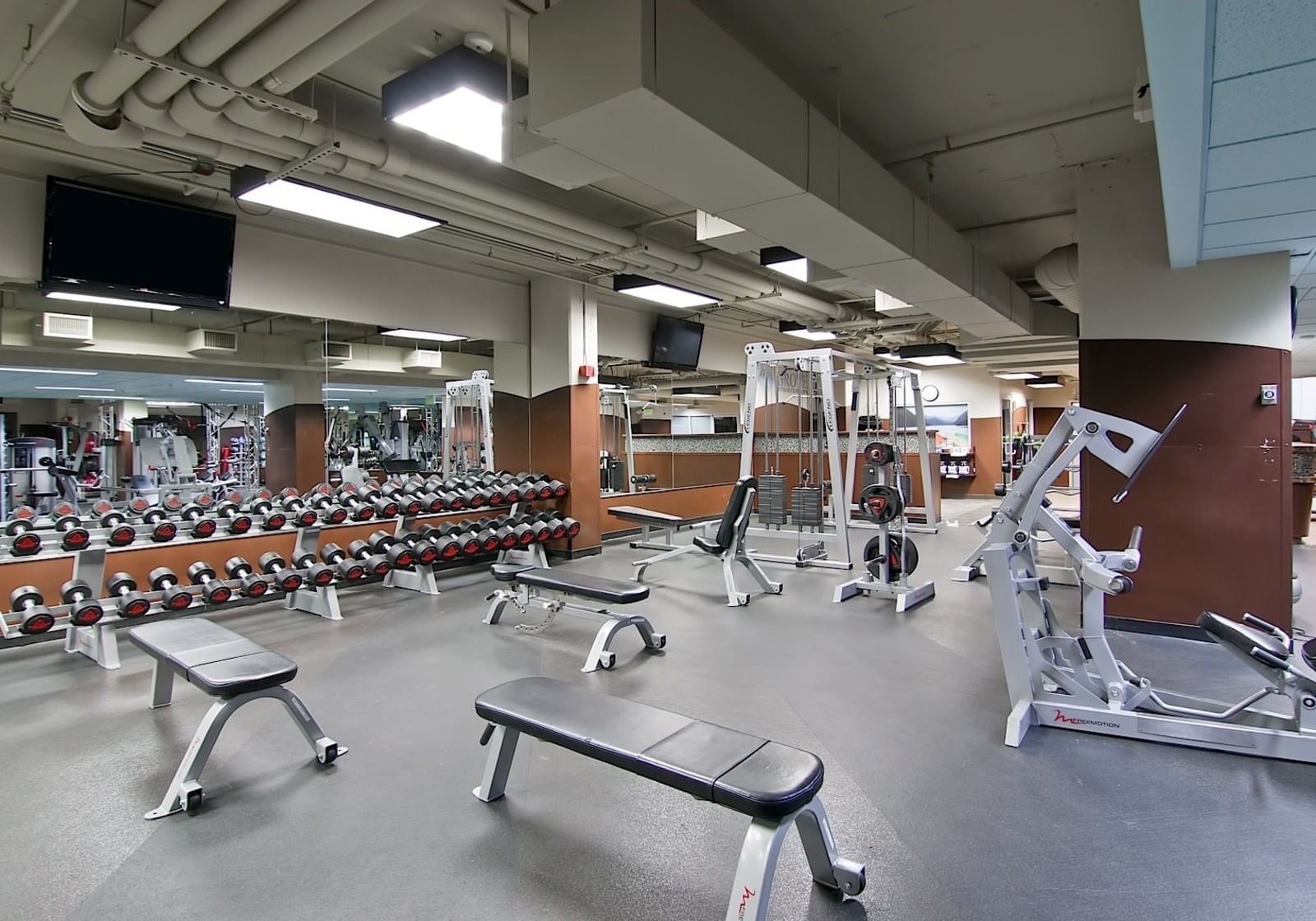 Interior of full fitness center at Grove Hotel