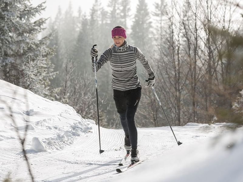 A girl while cross-country skiing near Falkensteiner Hotels
