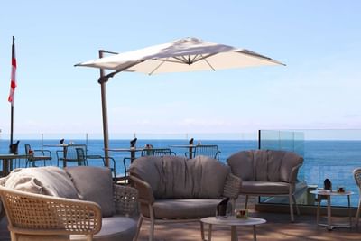 Lounge chairs and a Patio umbrella at Sublimis Boutique Hotel Camogli