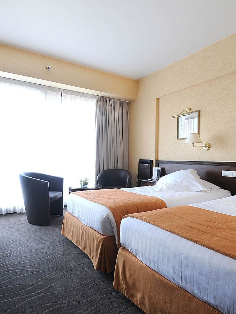 Chambre Deluxe avec deux lits jumeaux au Splendid Hotel & Spa Nice