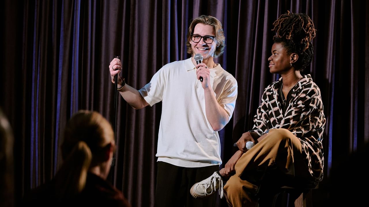 Two people doing stand up comedy