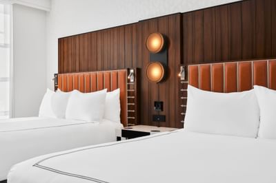 Cozy bedroom with modern interior & decor in 2 Queen Beds High Floor at Godfrey Hotel Detroit