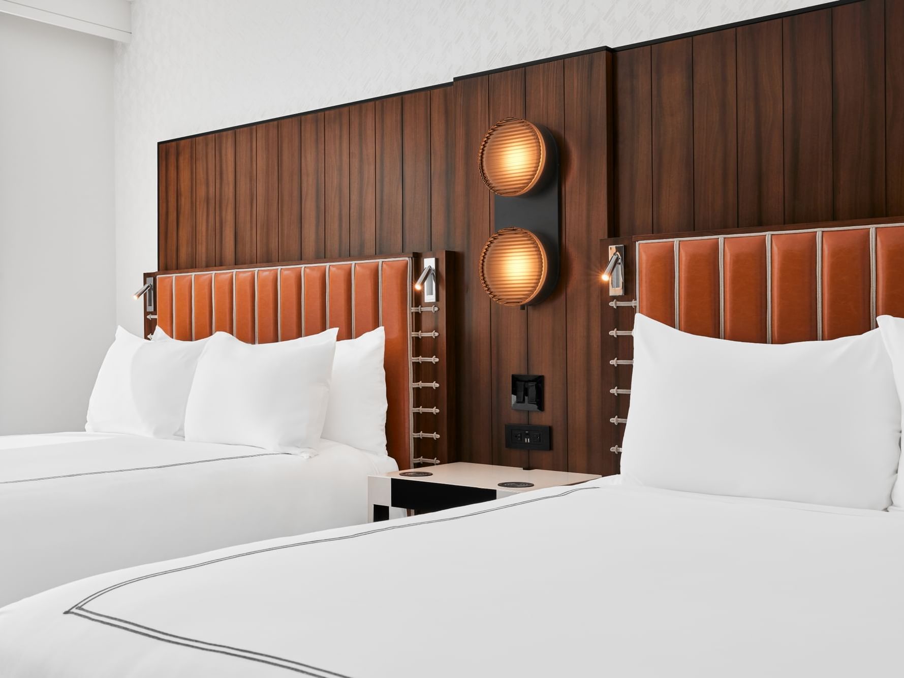 Cozy bedroom with modern interior & decor in 2 Queen Beds at Godfrey Hotel Detroit