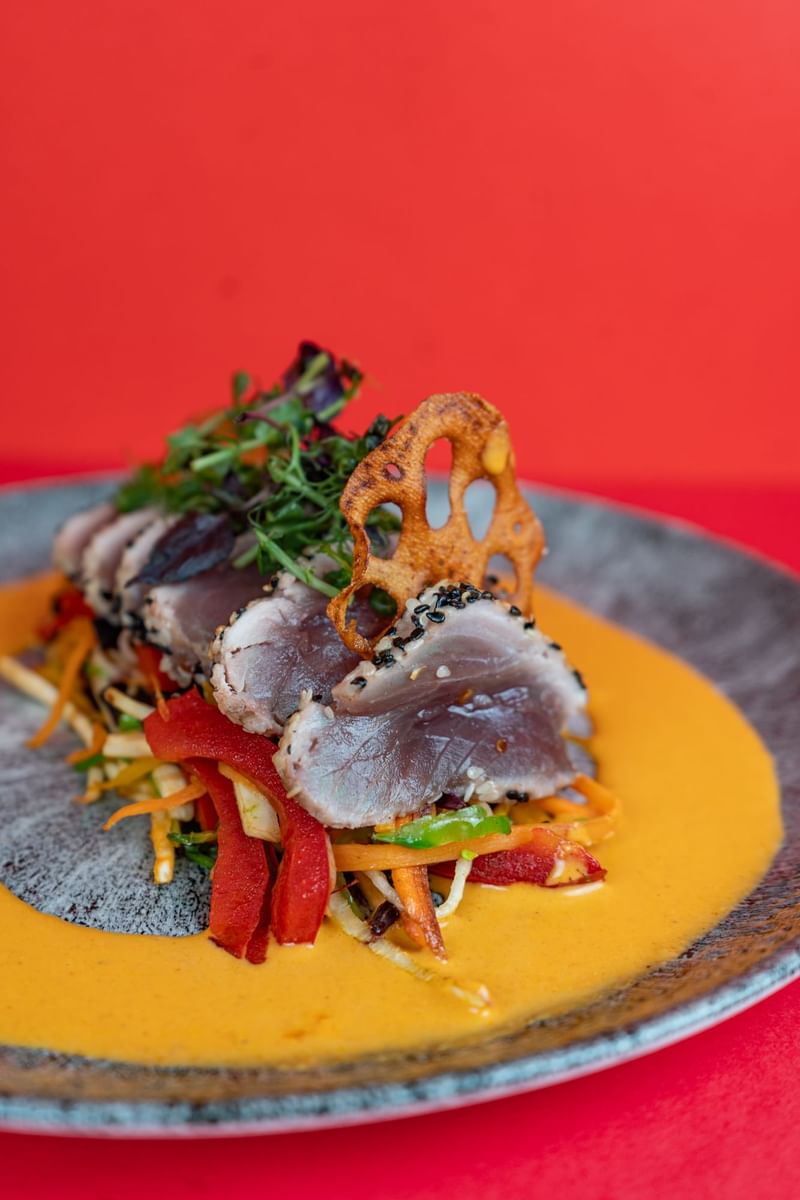 Close-up of yellowfin tuna served on a plate at Warwick Paris Champs Elysées
