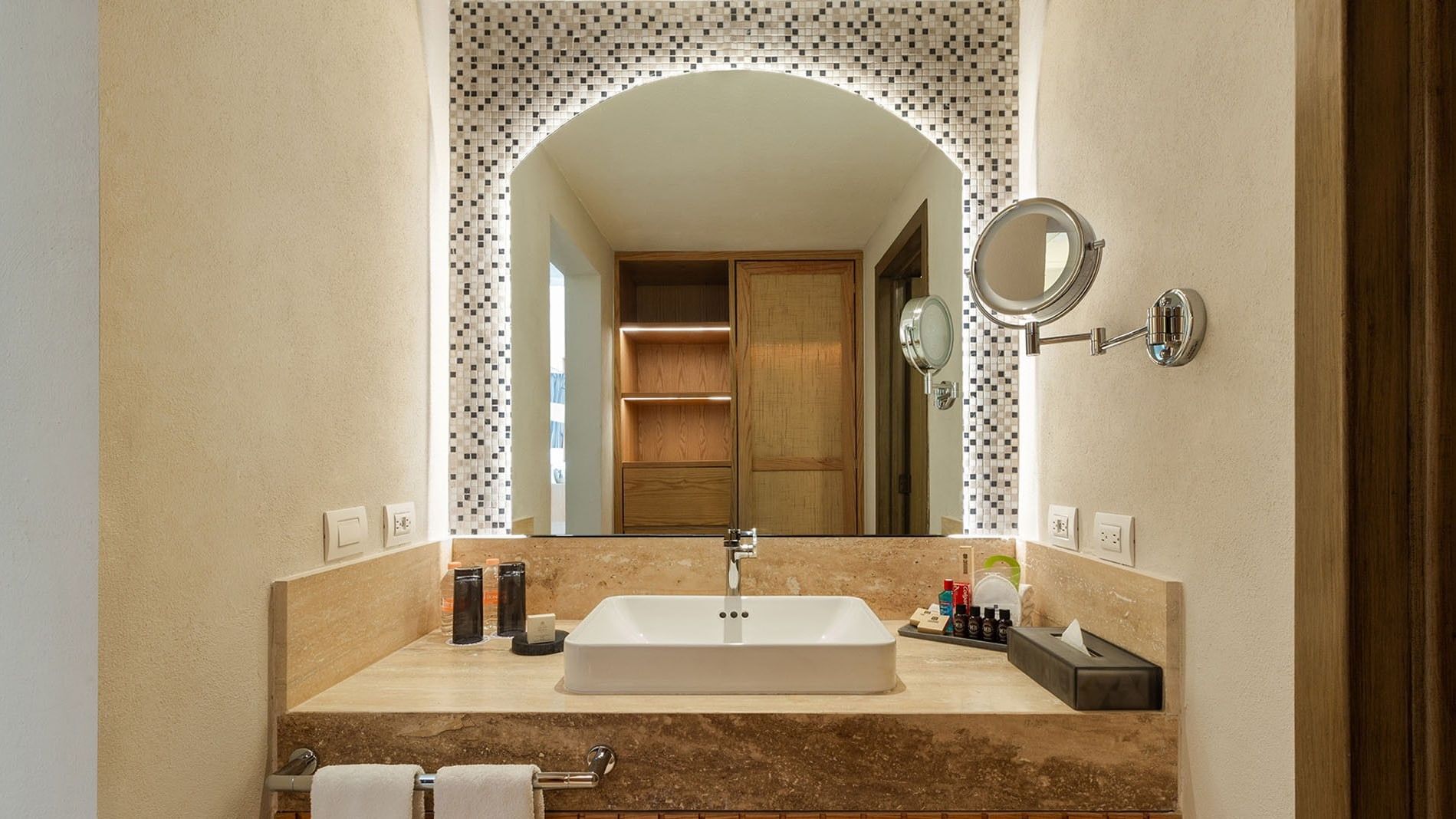 Two Double Camino Real Club with a large arched mirror, mosaic tile, and marble counter at Camino Real Acapulco Diamante