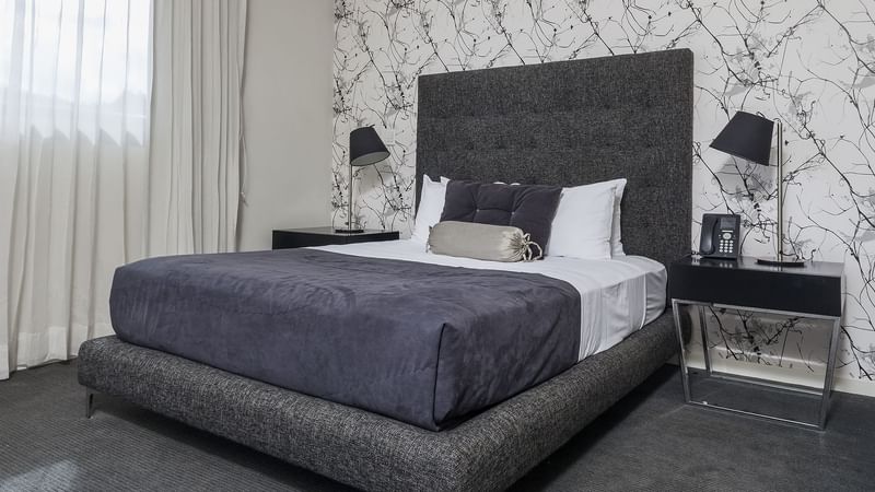 Bed of the Deluxe King room at Gamma Morelia Beló