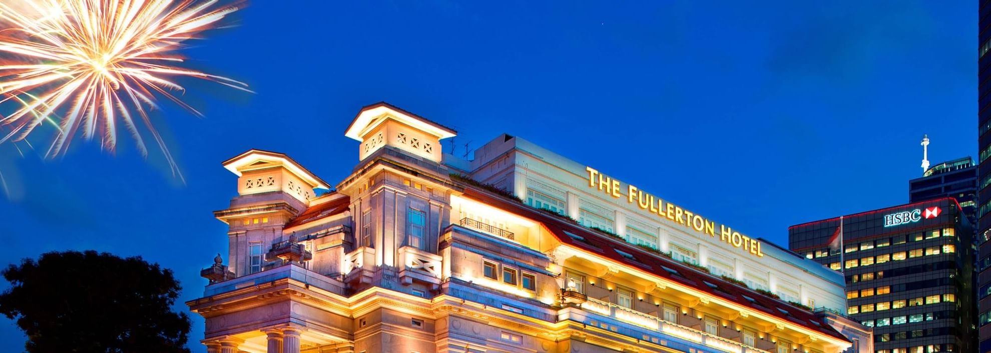 Exterior of The Fullerton Singapore with fireworks
