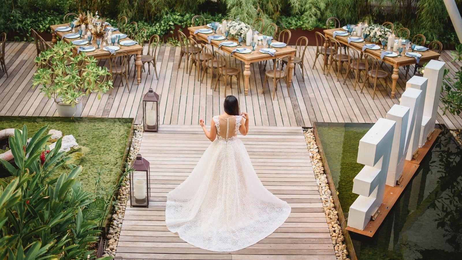 Bride walking on a pathway at Fiesta Americana Reforma