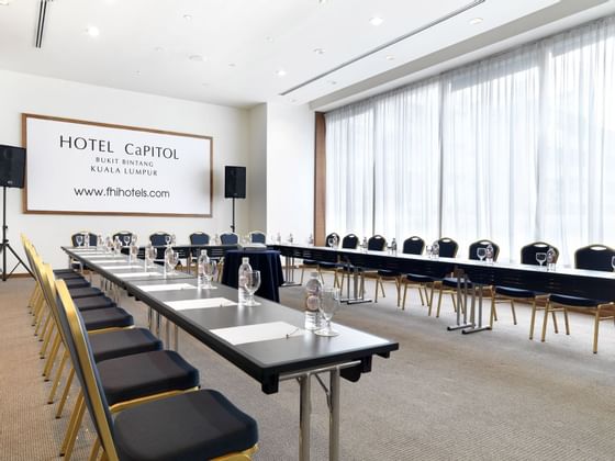 U-shaped meeting table setup at  Federal Hotels International