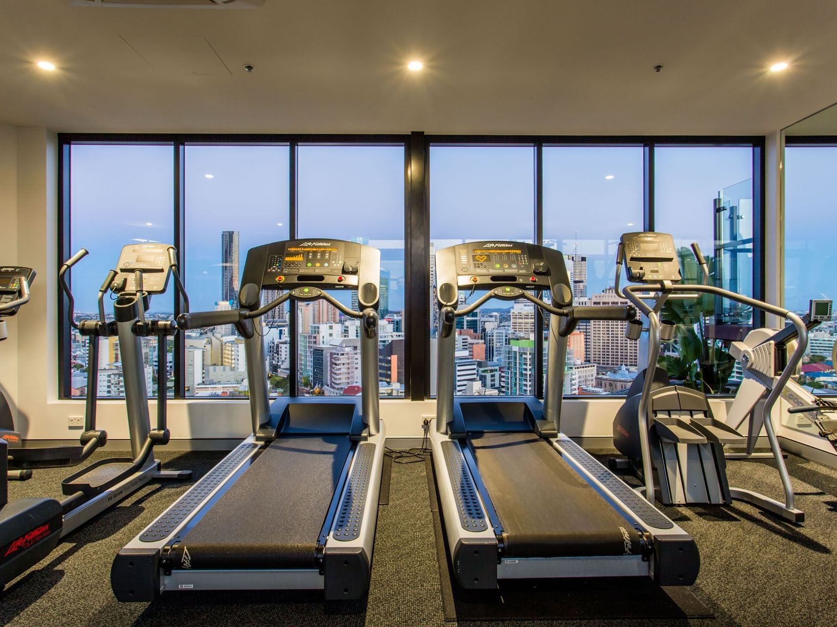 Equipment in rooftop gym at Grand Chancellor Brisbane