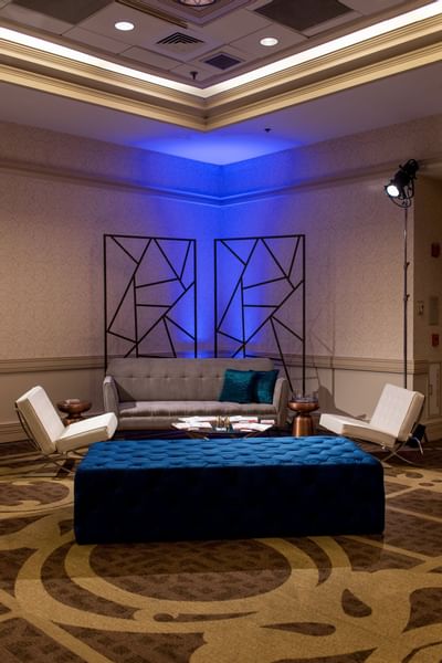 lounge area with chairs and carpet