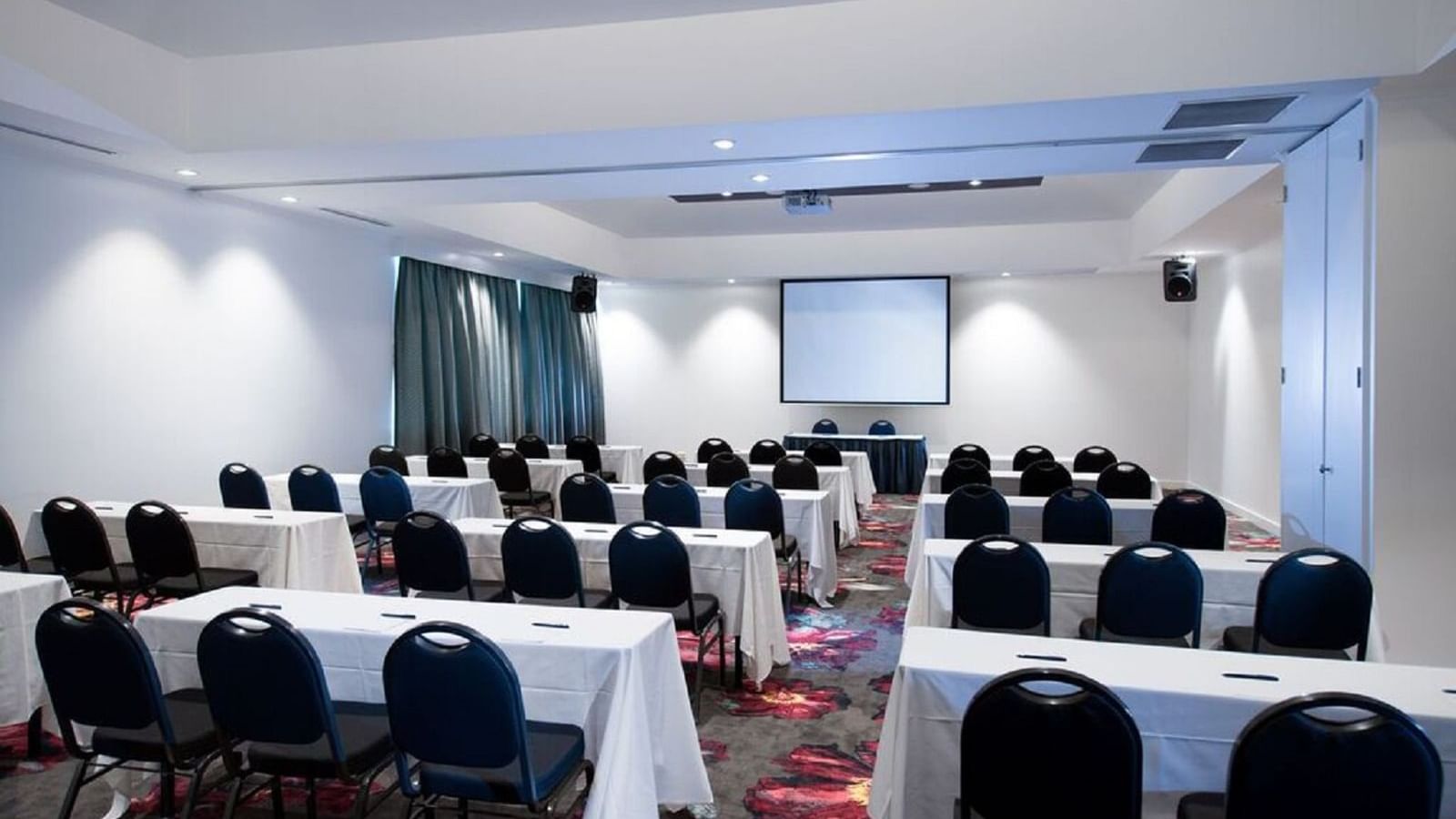 Table setup in Meeting hall with projector at Novotel Barossa