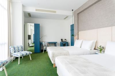 Double beds & lounges in the Suite at Metropol Hotel