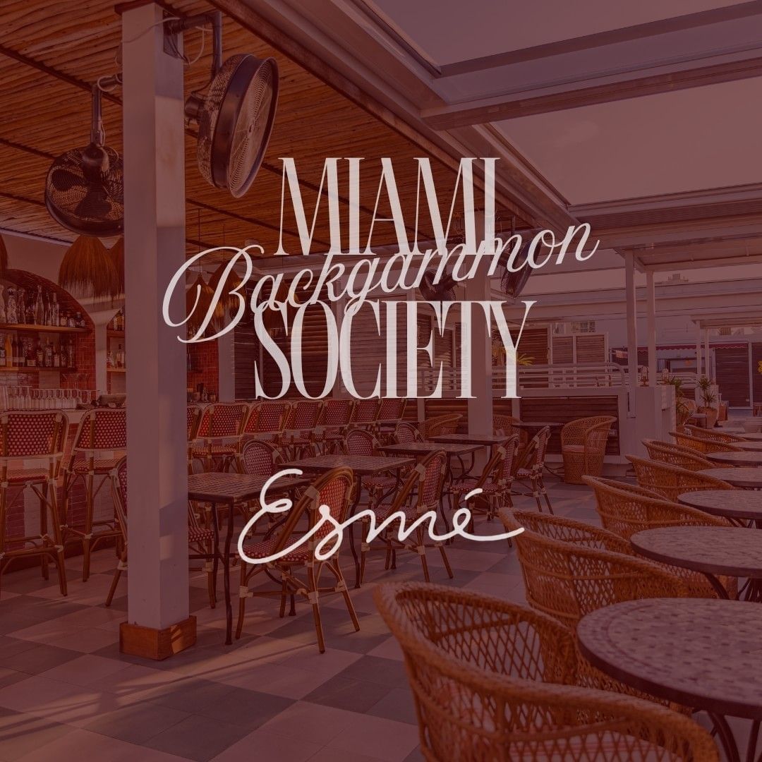 Rooftop dining area with wicker chairs and tables beneath wooden beams and ceiling fans for The Backgammon Society at The Roof