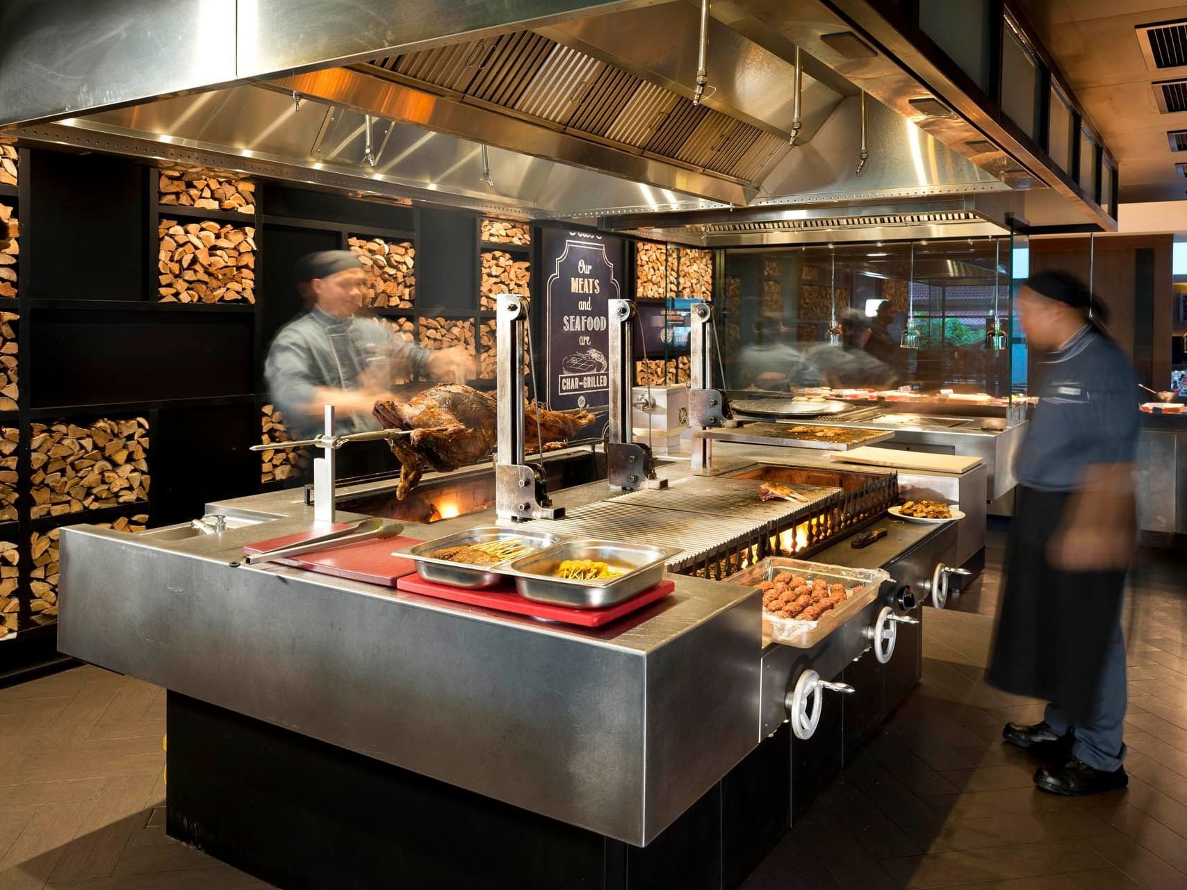 Chefs working by the counter in Charcoal at Saujana Hotel Kuala Lumpur