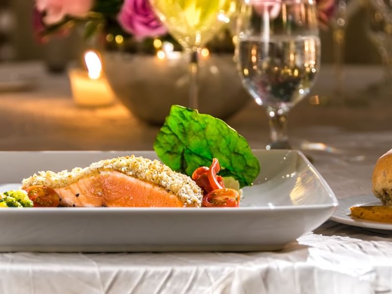 Close-up of smoked salmon dish served at Live Aqua Resorts