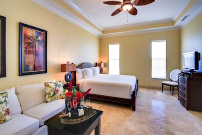 Bedroom with sofa in Turks & Caicos villa at Windsong Resort On The Reef