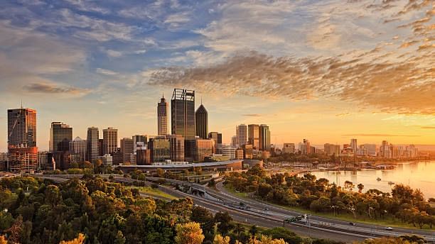 View of the Perth city skyline at Kings Park as the sun sets over the Swan River. 