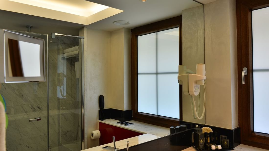 Bathroom vanity and other amenities in the Executive Room at Warwick Ankara