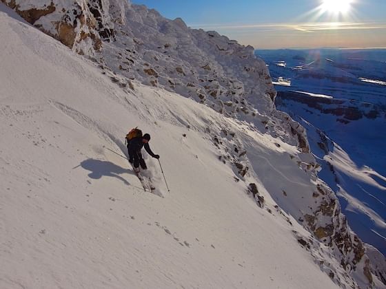 A man skiing at the mountains near Hotel Jackson