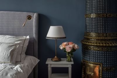 Nightlamp & a flower vase by the bed at The Sparrow Hotel