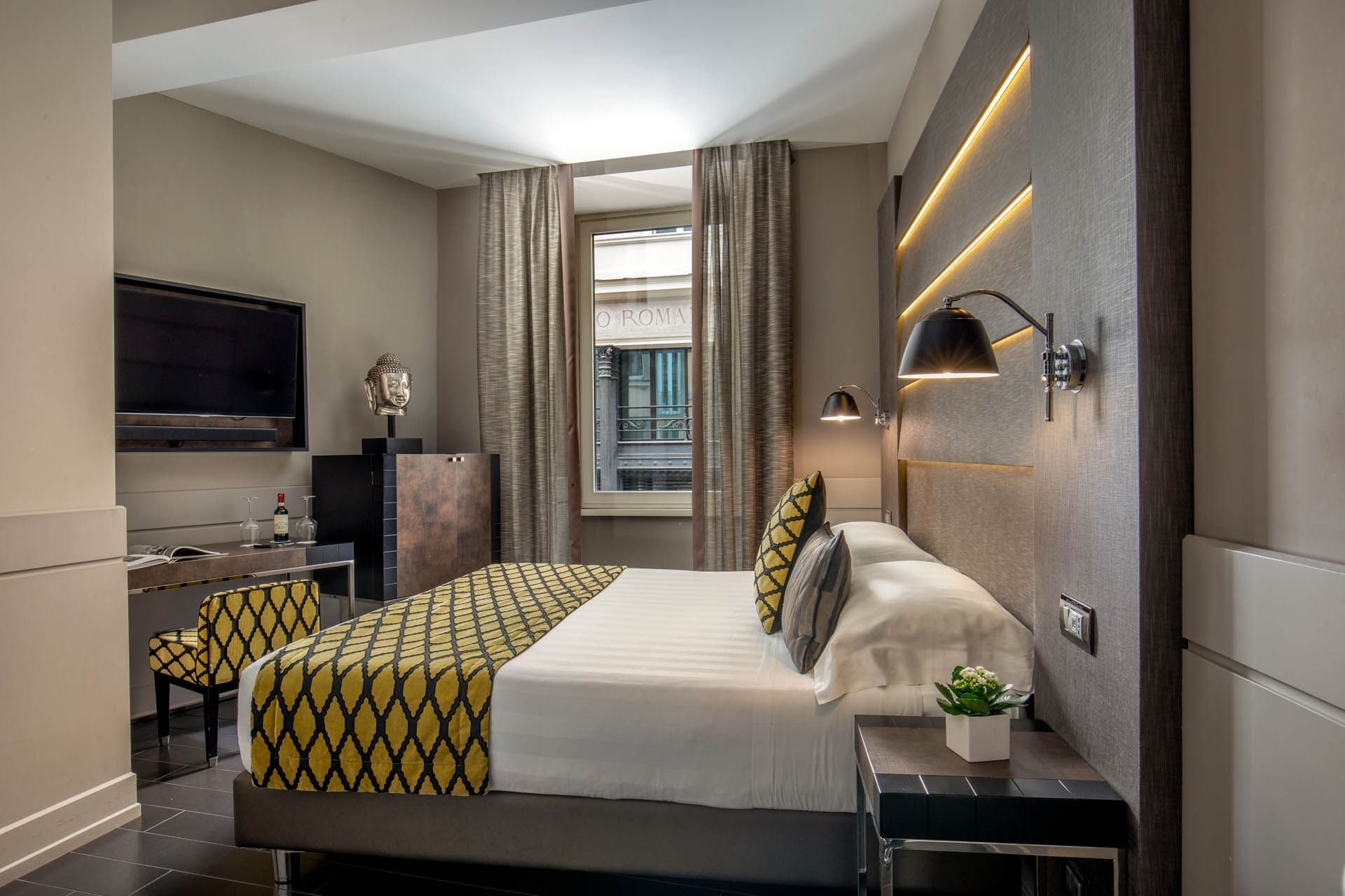 Interior of the Classic Room with a work desk by the king bed and window at The Style