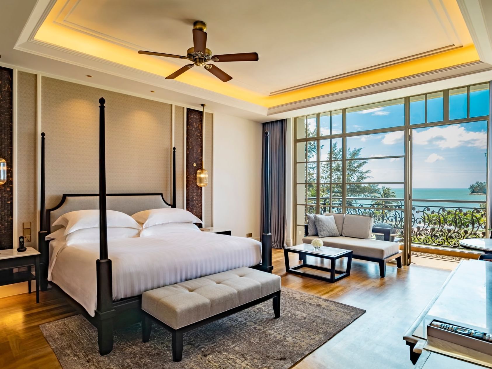 King bed in Viceroy Sea View with a balcony at Danna Langkawi Hotel