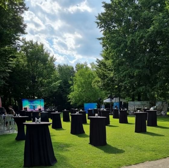 Cocktail tables in the garden for an event at Ana Hotels